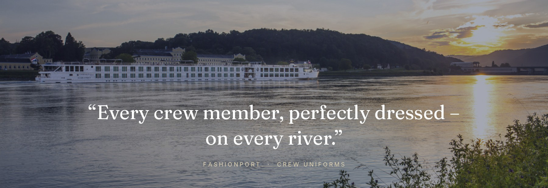 River cruise ship at sunset – every crew member perfectly dressed